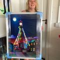 Jayne Edwards of Tredegar collects her painting 'Tredegar Clocktower Moonlight'.