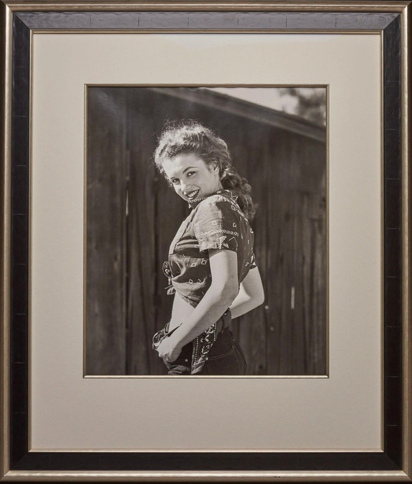 Marilyn Peaking Over Her Shoulder By André De Dienes